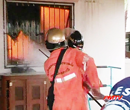 Firefighters try to contain the blaze.